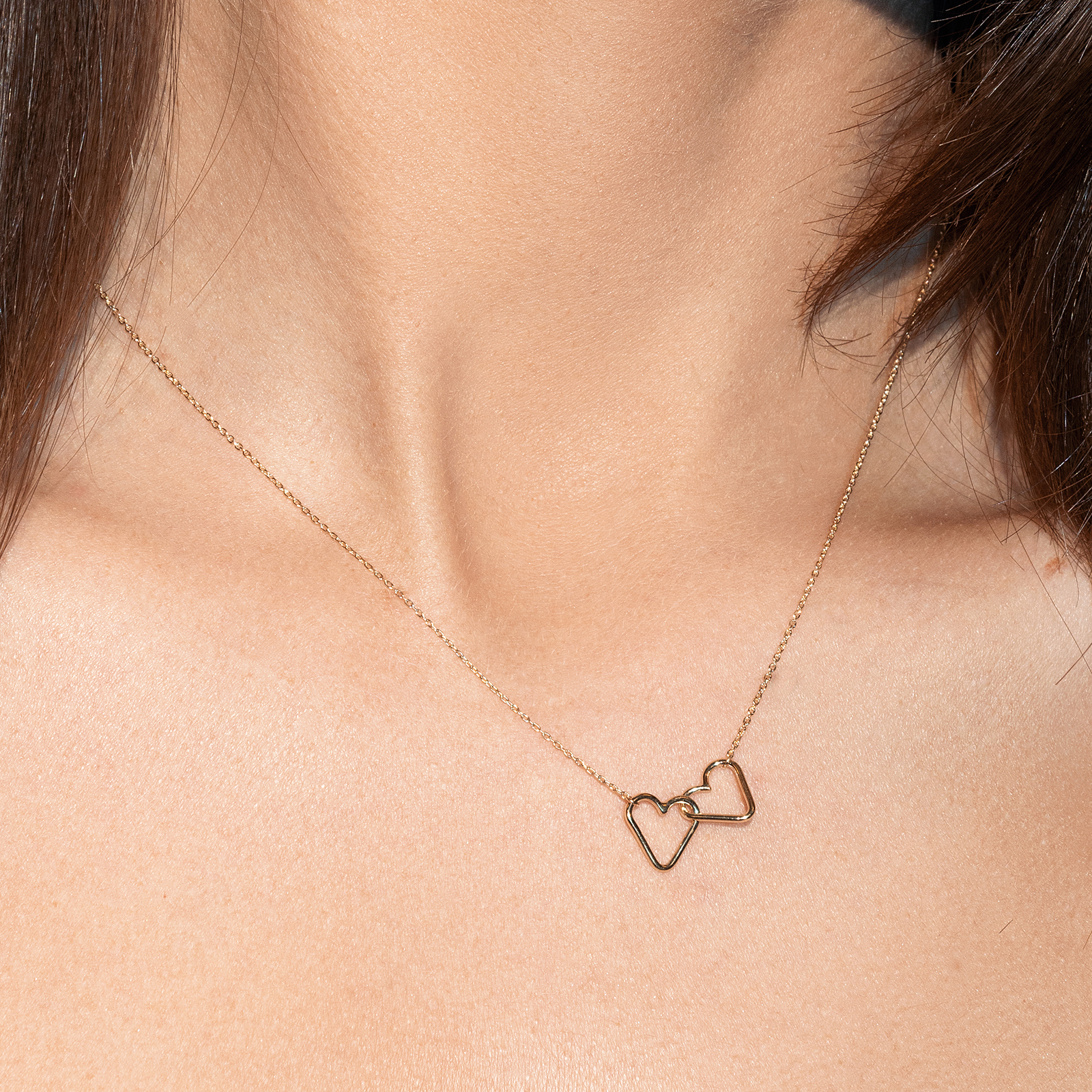 שרשרת זהב עם חיבור שני תליוני לב