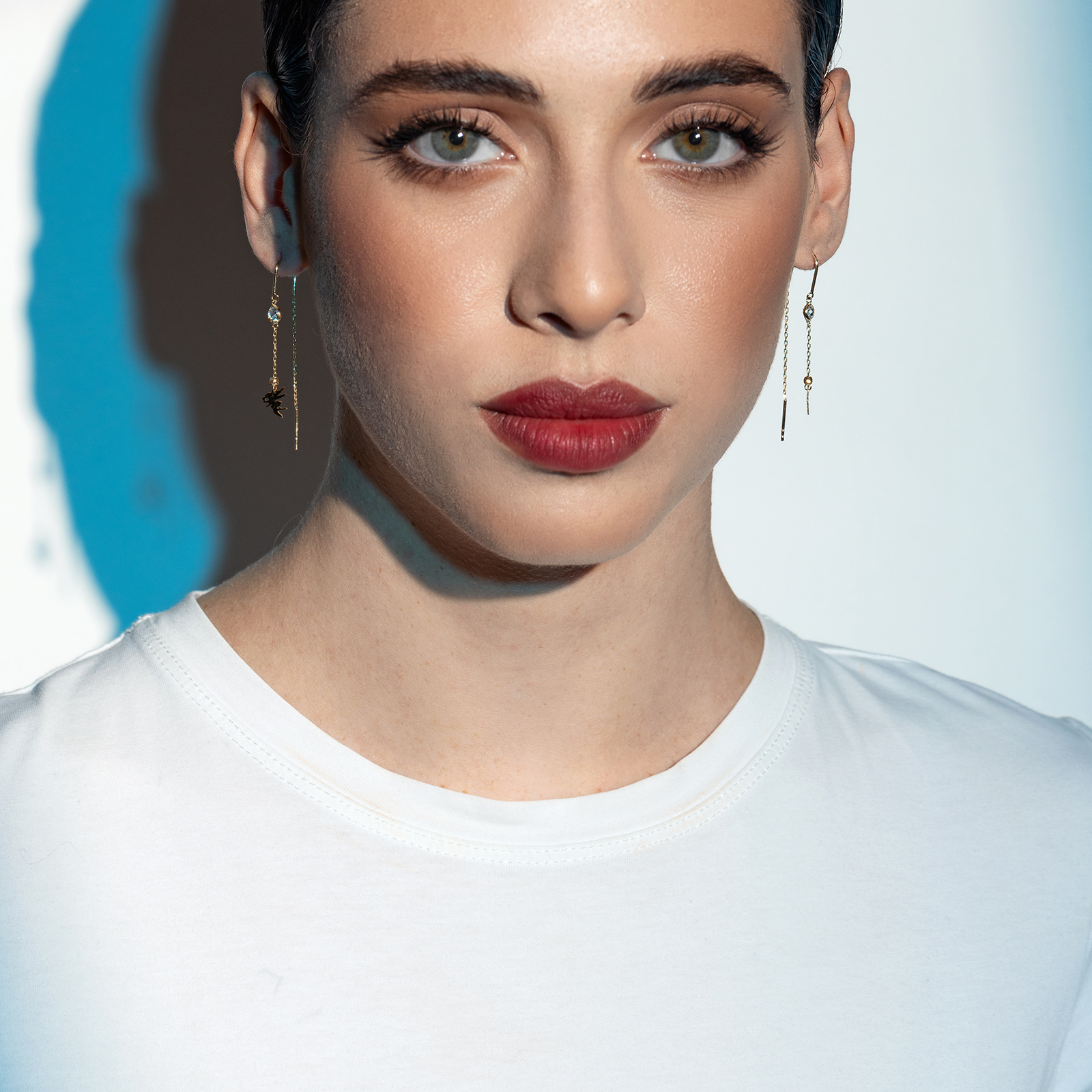 עגילי זהב ארוכים עם סיומת פיה