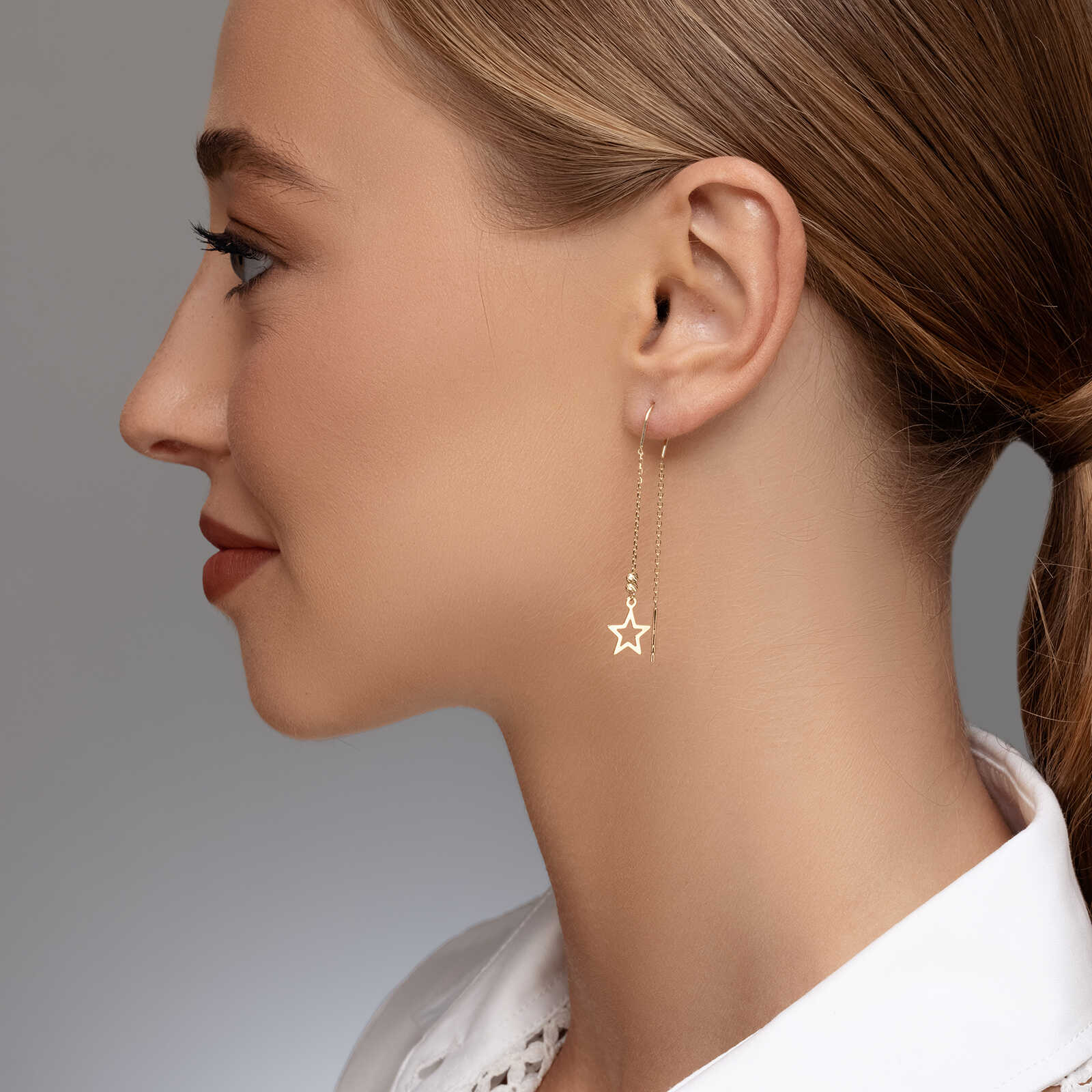 עגילי זהב נלי-  תלויים עם סיומת כוכב